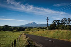 Networks in remote rural regions of New Zealand are aging and require renewal investment to provide safe and reliable service. Powerco’s distribution network is predominantly an overhead line network constructed with concrete poles, timber cross arms and porcelain insulators using a wide variety of conductor types. (Taranaki regional landscape with mountain). Networks in remote rural regions of New Zealand are aging and require renewal investment to provide safe and reliable service. Powerco’s distribution network is predominantly an overhead line network constructed with concrete poles, timber cross arms and porcelain insulators using a wide variety of conductor types. (Taranaki regional landscape with mountain).