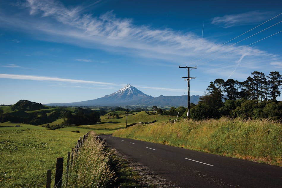 Networks in remote rural regions of New Zealand are aging and require renewal investment to provide safe and reliable service. Powerco&rsquo;s distribution network is predominantly an overhead line network constructed with concrete poles, timber cross arms and porcelain insulators using a wide variety of conductor types. (Taranaki regional landscape with mountain).