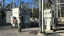 Wayne Gideons visually inspects breaker disconnects to identify any potential problems.