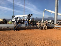 For safety, crews were required to wear masks despite the over-90° heat. For safety, crews were required to wear masks despite the over-90° heat.