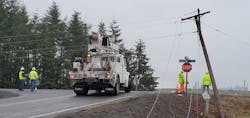 A contract crew working for Portland General Electric prepares to re-set a power pole and equipment damaged during the storm. A contract crew working for Portland General Electric prepares to re-set a power pole and equipment damaged during the storm.