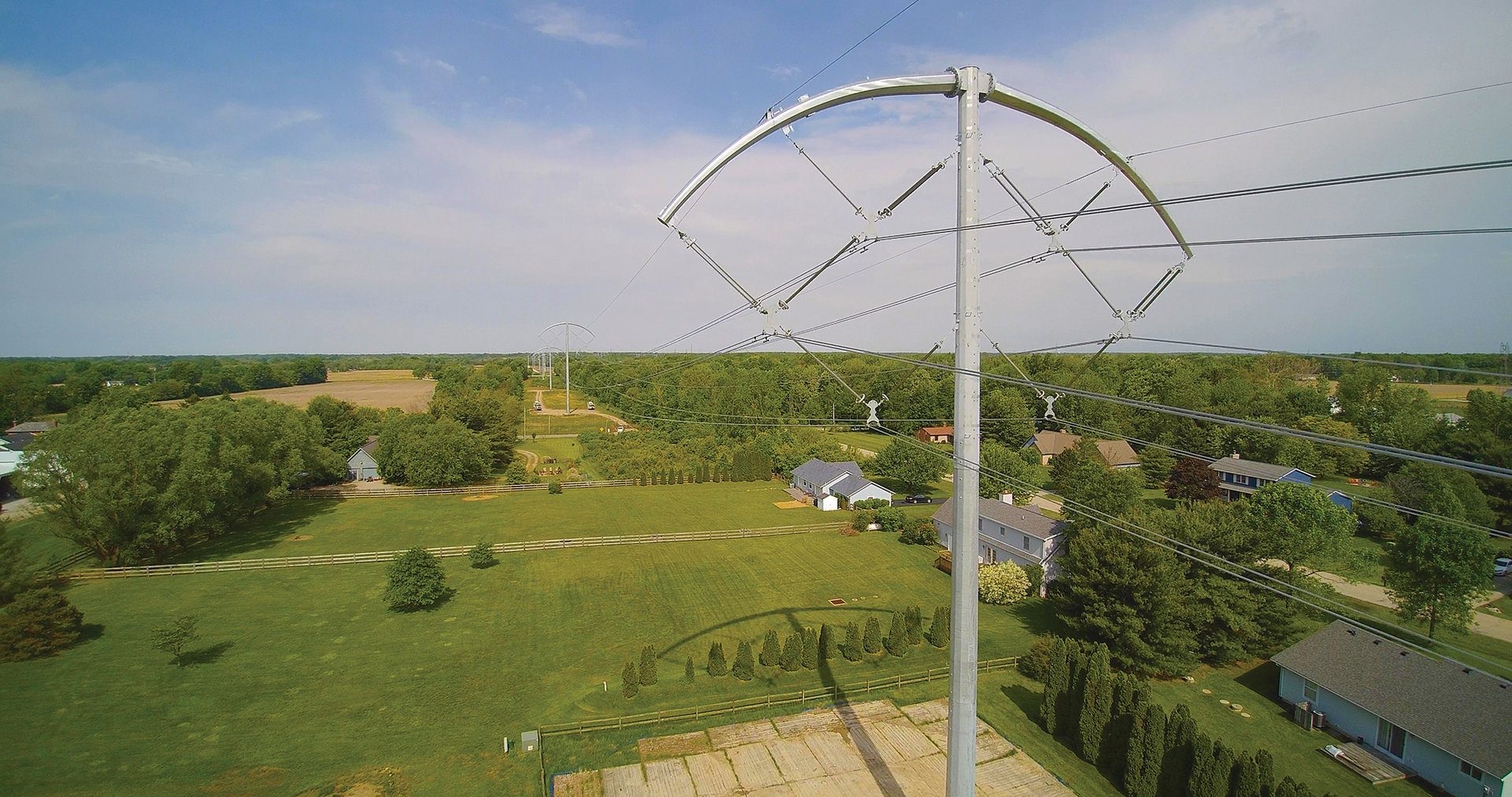 The BOLD solution features a streamlined, low-profile structure with phase-conductor bundles arranged in compact delta configurations.