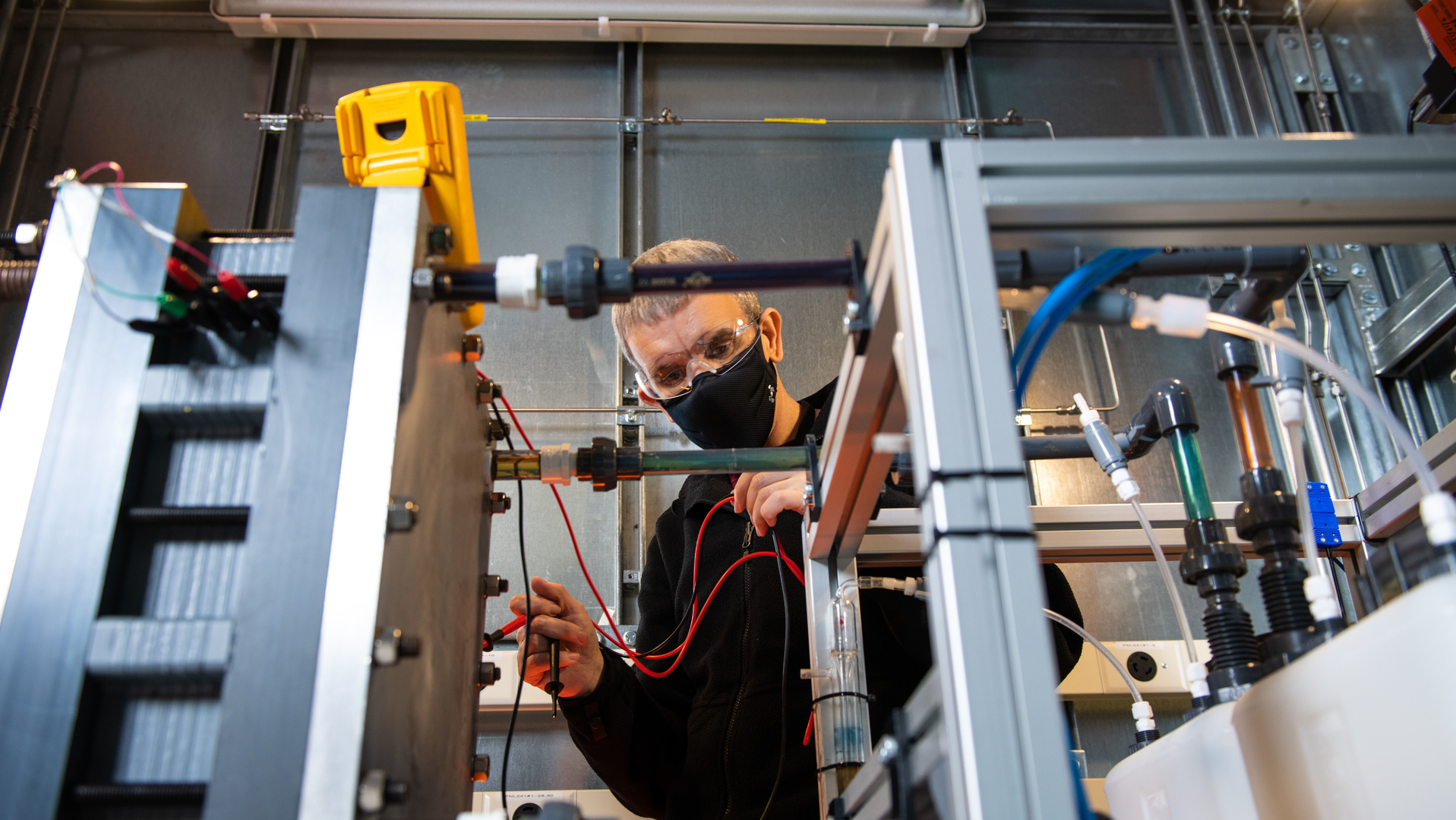 Flow battery technology, where chemical energy is provided by two chemical components dissolved in liquids and stored in separate tanks that are pumped through the battery system, is a promising, yet still immature technology, for grid energy storage applications. It can scale easily, uses lower-cost/more abundant materials, and is safer than many current generation battery technologies. Pictured above, a scientist at works on a flow battery design on one of PNNL&rsquo;s prototyping labs.