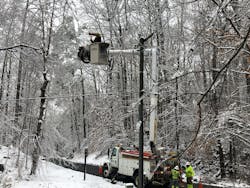 A lineworker restores power in Carroll County, Virginia.