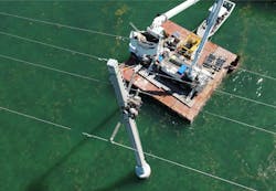 The crew on the structure removes the old polymer while a barehand lineman installs the AGS Unit on the 138-kV conductor. The crew on the structure removes the old polymer while a barehand lineman installs the AGS Unit on the 138-kV conductor.