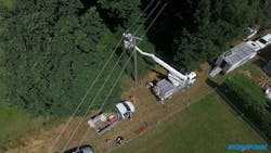 A Sigmaform Switzerland utility crew installs MVLC on a forested area in Geneva, Switzerland. A Sigmaform Switzerland utility crew installs MVLC on a forested area in Geneva, Switzerland.