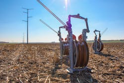 Ameren installed more than 2,200 steel monopole structures on single shaft concrete foundations throughout the 375 mile transmission line. Fly dollies, pictured above, are used to pull in lead lines with helicopters, which later pull in the 954 Cardinal conductor. Ameren installed more than 2,200 steel monopole structures on single shaft concrete foundations throughout the 375 mile transmission line. Fly dollies, pictured above, are used to pull in lead lines with helicopters, which later pull in the 954 Cardinal conductor.