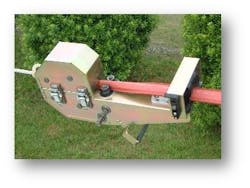 Covering a span of overhead conductors with the MVLC installation tool. Covering a span of overhead conductors with the MVLC installation tool.