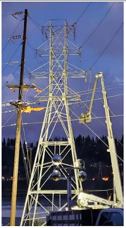 Line crews for Portland General Electric repair damaged transmission lines crossing the Willamette River near Oregon City, Oregon. Line crews for Portland General Electric repair damaged transmission lines crossing the Willamette River near Oregon City, Oregon.