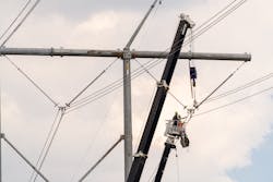 Transmission line workers repair a line that connects substations in Hartburg, Texas, and Rhodes, Louisiana.