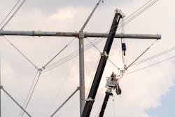 Transmission line workers repair a line that connects substations in Hartburg, Texas, and Rhodes, Louisiana. Transmission line workers repair a line that connects substations in Hartburg, Texas, and Rhodes, Louisiana.