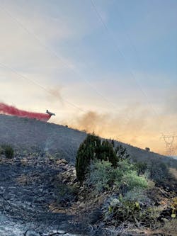 Aerial retardant drop is observed over WAPA’s 230kV powerline. Aerial retardant drop is observed over WAPA’s 230kV powerline.