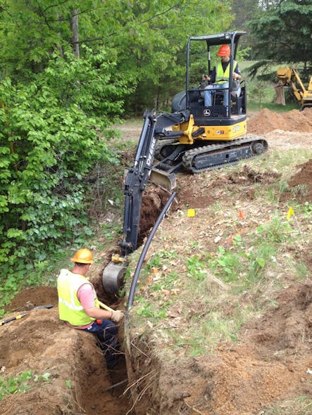 Crews dig trench to install underground cable as part of SMRP. To date, WPS has installed 1629 miles of underground circuits.