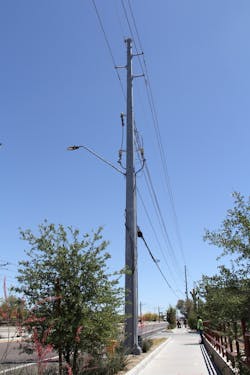 This existing pole has a 12 kV underground rise adding to the congestion.