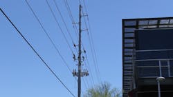 This existing pole has the 69 kV line with a 12 kV line and communications cables making it very congested. This existing pole has the 69 kV line with a 12 kV line and communications cables making it very congested.