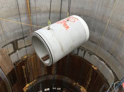 Another section being lowered into the access shaft. Another section being lowered into the access shaft.