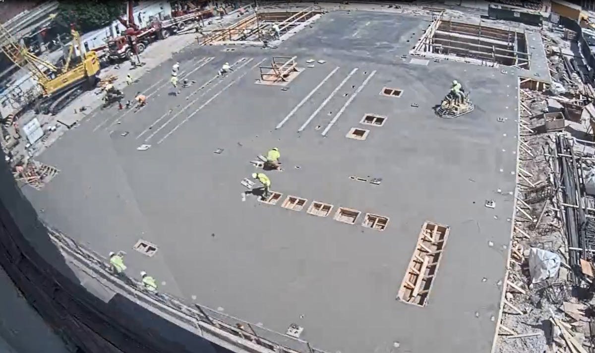 First-floor concrete finishing underway. In the foreground are the framed openings for the control room. Mid-ground, notice embedded rails for GIS (on left) and 13.2-kV switchgear (on right) with transformer bays, with drive bay (in middle at top).