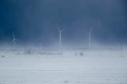 Wind turbines in a snow storm. Wind turbines in a snow storm.