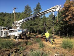 During 10-year project, line crews overcame numerous pole-installation challenges — steep inclines and hard drilling. During 10-year project, line crews overcame numerous pole-installation challenges — steep inclines and hard drilling.
