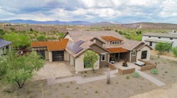 A house at Mandalay Homes&rsquo; Jasper planned community in Prescott Valley, Arizona. The homes use green building technology, and the project includes a 23 MWh networked energy storage system to store solar power.