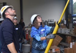 With the help of instructor J.T. Jacobs, Shanoa Wright of Louisa County High School operates a hot stick at the Girl Power Camp. With the help of instructor J.T. Jacobs, Shanoa Wright of Louisa County High School operates a hot stick at the Girl Power Camp.