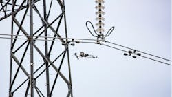 Drone conducts aerial inspection of transmission tower. Drone conducts aerial inspection of transmission tower.