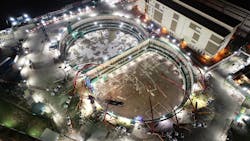 Nighttime view of concrete casting process at basement 4. (Concrete pumps and trucks can be seen at ground level.) Nighttime view of concrete casting process at basement 4. (Concrete pumps and trucks can be seen at ground level.)
