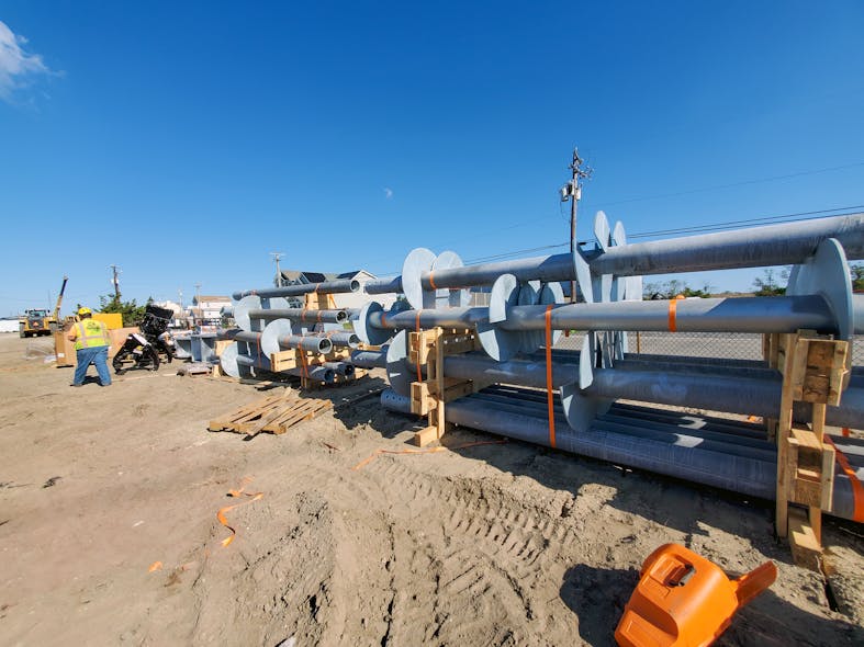 Helical piles were delivered to the staging area prior to installation. For the four structures, 32 piles and one sacrificial pile for load testing were used.