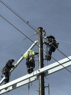 Crews climbing and working off of removable ladders. Crews climbing and working off of removable ladders.