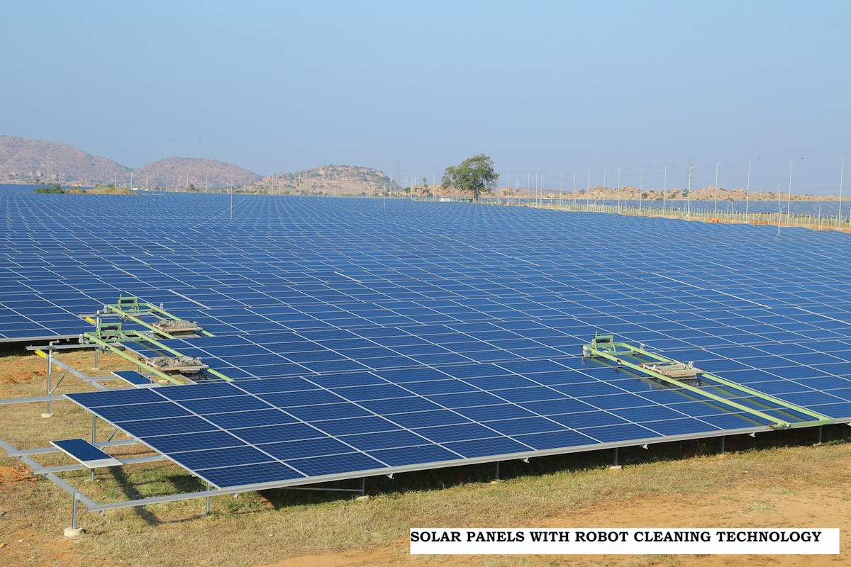 Pavagada solar park showing use of solar panel robot cleaning technology.