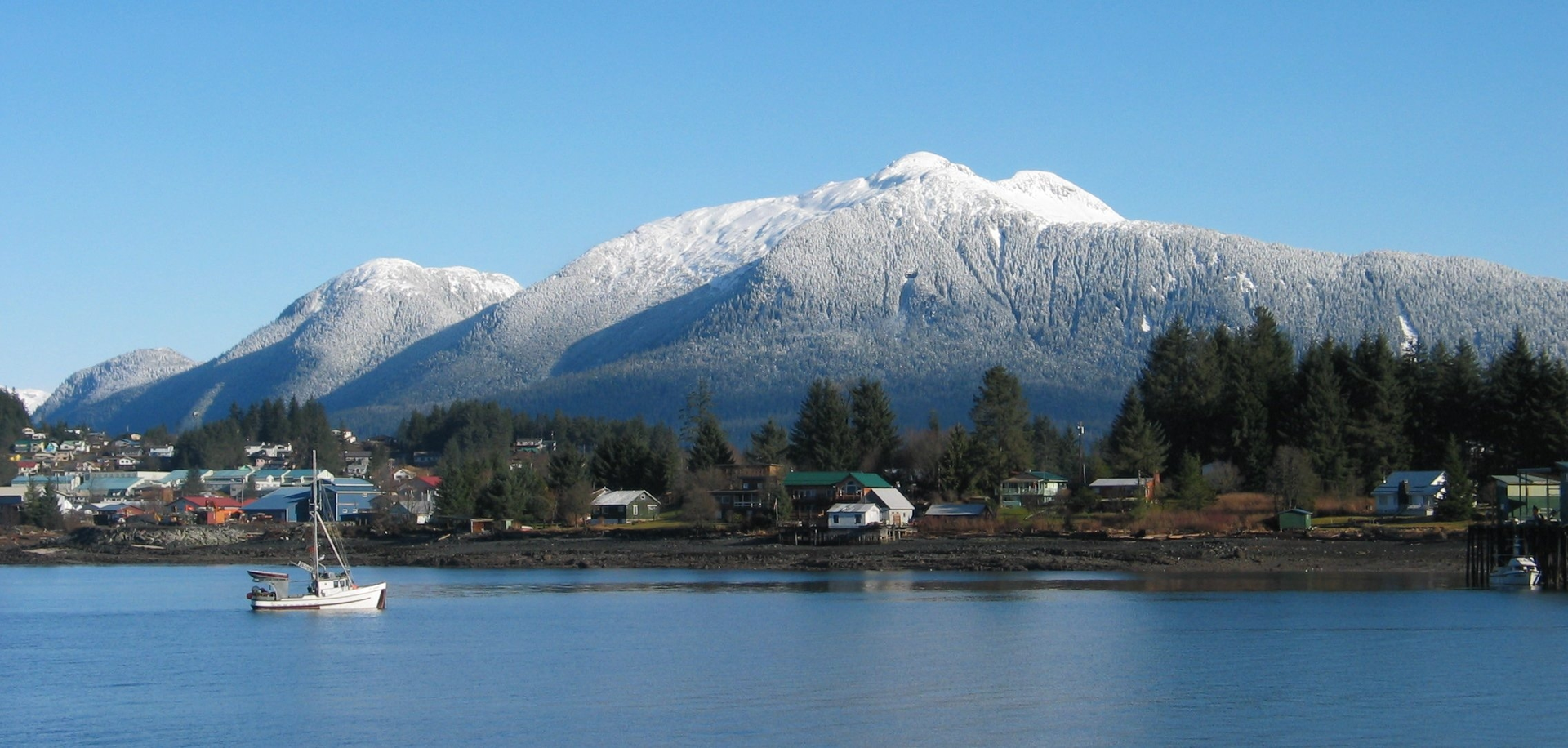 A small fishing boat heads for the cannery in Wrangell, Alaska. Wrangell Island is part of the Alexander Archipelago that hugs the North American continent near the border between Alaska and the U.S. and British Columbia, Canada.