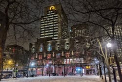 Montreal street scene at night with Hydro-Quebec's headquarters in the background. Montreal street scene at night with Hydro-Quebec's headquarters in the background.