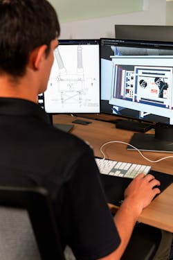 A developer works on a mobile app that helps substation technician apprentices visualize substation components. A developer works on a mobile app that helps substation technician apprentices visualize substation components.