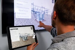 A developer demonstrates a tablet-based substation safety and awareness app for substation technician apprentices.