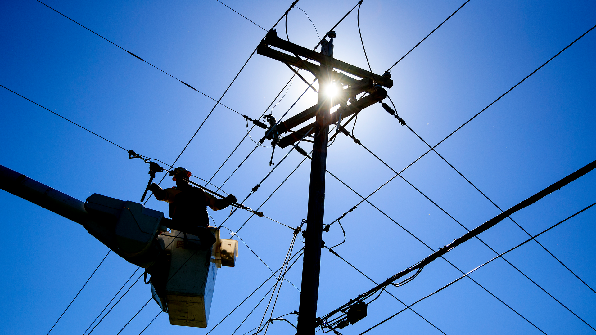 A Santee Cooper line worker performs maintenance on a distribution line. The utility delivers power to more than 200,000 residential and commercial customers.