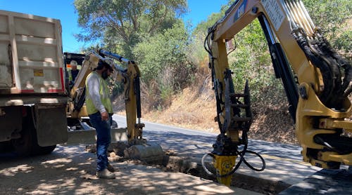 Crew cutting trenches running parallel to existing overhead distribution line. PG&amp;E successfully completed undergrounding nearly 4 miles (6.4 km) of overhead power lines in Santa Rosa, California, U.S.