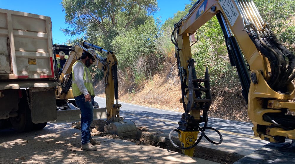 Crew cutting trenches running parallel to existing overhead distribution line. PG&amp;E successfully completed undergrounding nearly 4 miles (6.4 km) of overhead power lines in Santa Rosa, California, U.S.