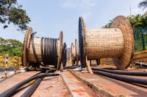 New spools of high voltage cable are deployed for installation in an undergrounding project. The lengths of underground lines are subject to certain physical limitations which, when exceeded, cause untimely wear and tear.