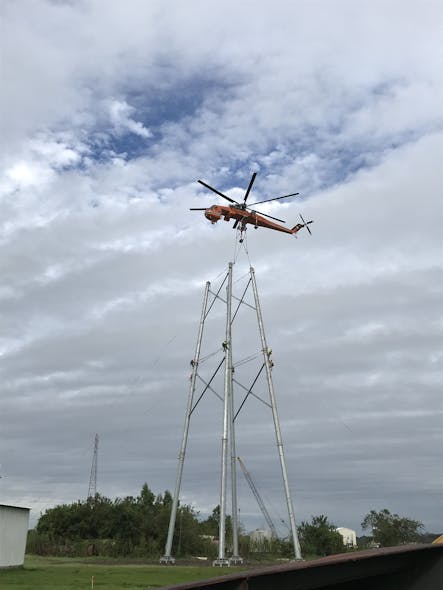 A heavy-lift helicopter, the Erickson Air Crane, was used to set the poles for the transmission structures which were built in sections.