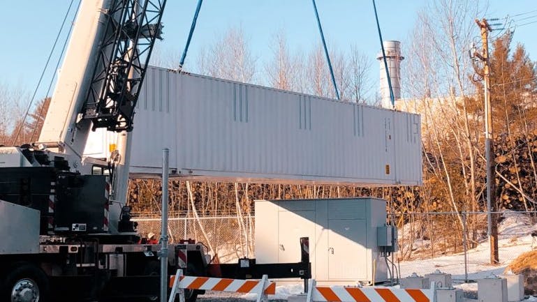 Lifting a container into place at an Agilitas Energy energy storage system. When MEW sought a way to provide further savings for its customers a few years later, it opted to install a 1.5-MW, 3-MWh behind-the-meter BESS to increase its energy storage capacity