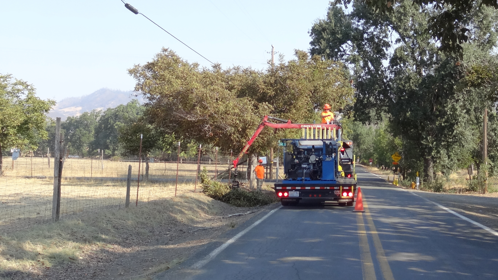 Loggers Unlimited cutting and gathering material to drop into piles along the roadside.
