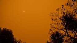 A bushfire clouds the sky with smoky haze in New South Wales, Australia. A bushfire clouds the sky with smoky haze in New South Wales, Australia.