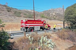 Firefighters apply long term fire retardant. California utilities were some of the first to deploy the technology. Firefighters apply long term fire retardant. California utilities were some of the first to deploy the technology.