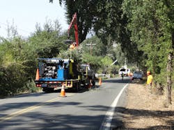 Baling oak trimmings while closely following VM trimming crew. Baling oak trimmings while closely following VM trimming crew.