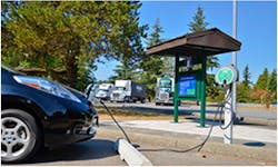 A public EV charger at a highway rest area. A public EV charger at a highway rest area.
