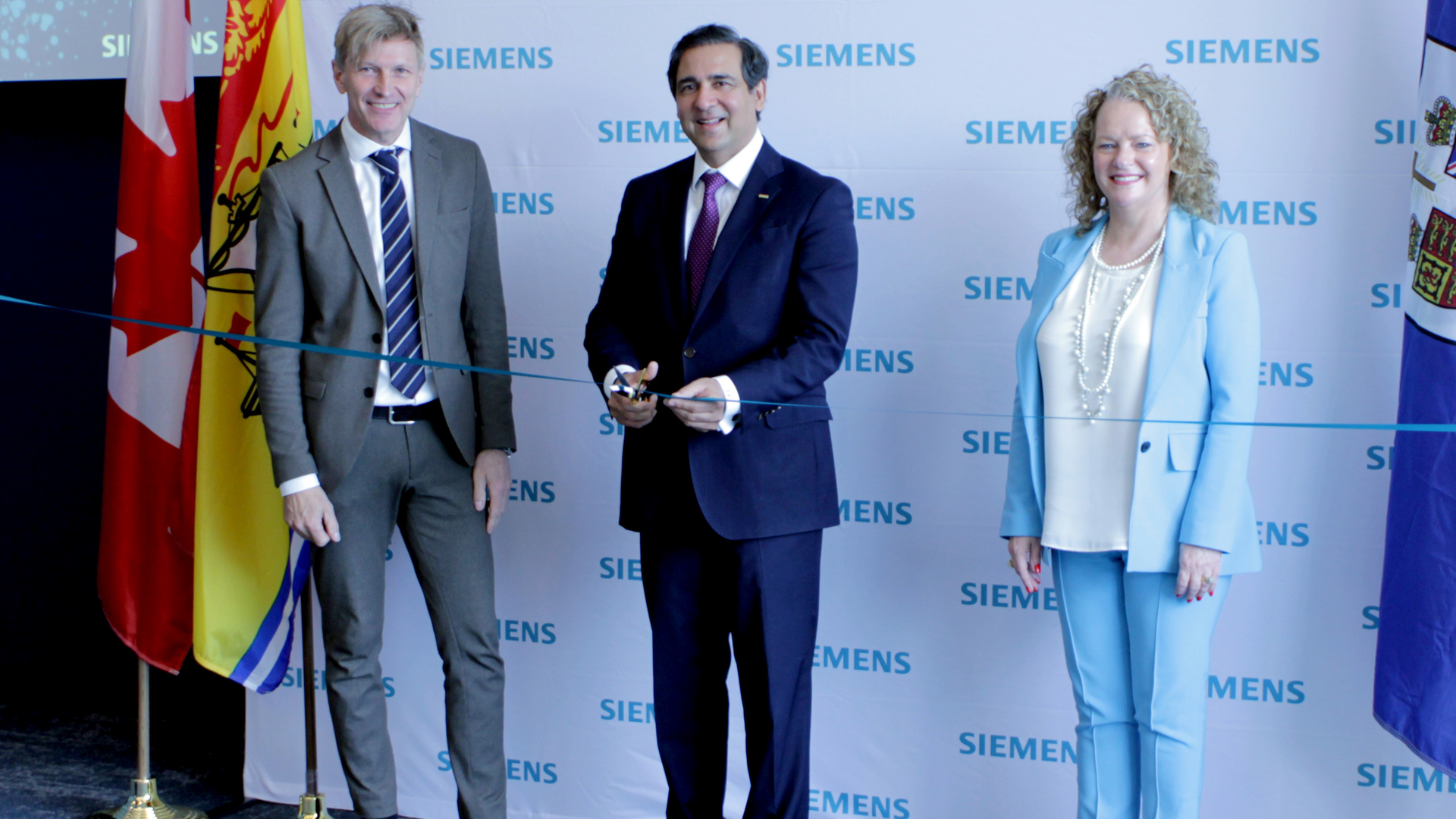 The opening ceremony of the critical infrastructure defence center in Canada. Dr. Andreas Kind, head of cybersecurity & trust from Siemens AG; Faisal Kazi, president and CEO, Siemens Canada Ltd.; Honorable Arlene Dunn, New Brunswick minister of aboriginal affairs, minister responsible for economic development and small business, minister responsible for opportunities NB, and the minister responsible for immigration.