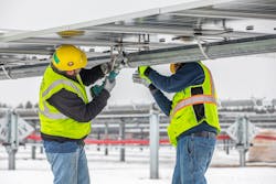 Construction workers at Alliant Energy’s Wood County Solar project (Wis.) install panels. Construction workers at Alliant Energy’s Wood County Solar project (Wis.) install panels.