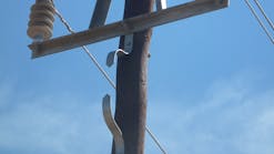 Example of spark gap mounted on wood pole to protect pole from damage to lightning flashover and resultant power frequency follow current.