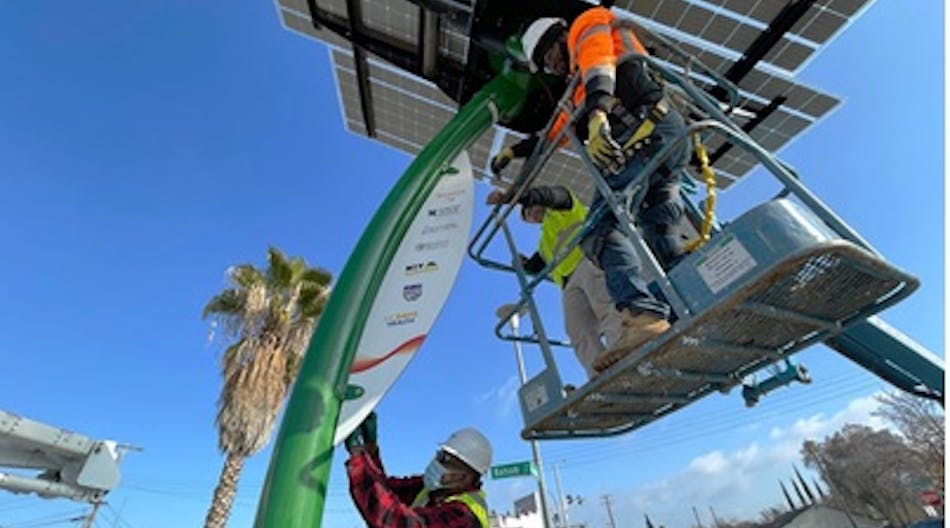 Students (in bucket) from SMUD Energy Careers Pathways program, for adults ages 18 and up, receive hands-on technical skills education needed to work in the solar energy field.