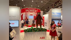 Jessica Ragzy Ewud shows off her creation, a Lego bear, at the ABB exhibit at IEE PES T&amp;D. She does wall mural lego installations for corporate and special events. Her 20-foot waterfall at another event contained more than 100,000 pieces.